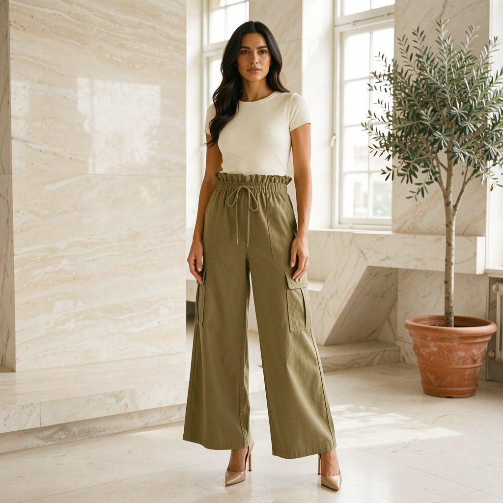 Model wearing khaki drawstring frilled waist wide leg utility trousers, front view