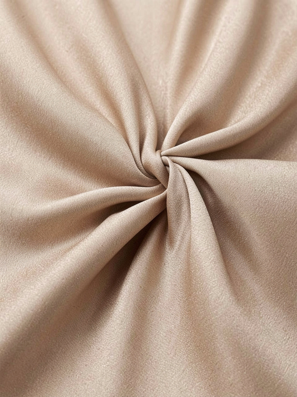 Fabric detail of satin twist-knot front on blouse